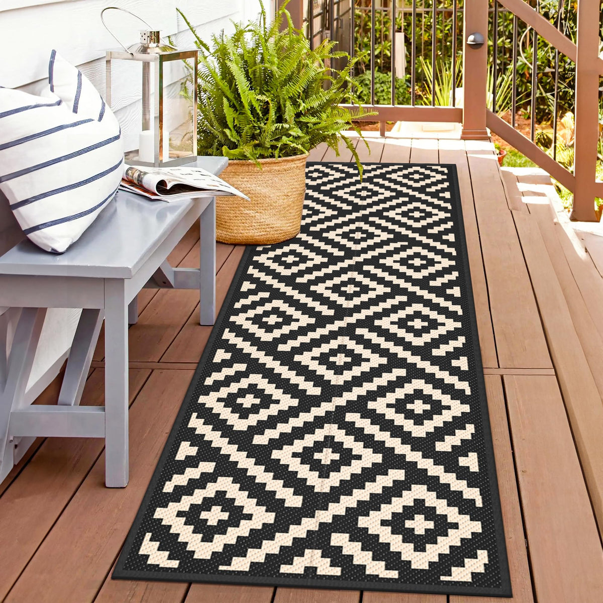 GENIMO 2-5x8 outdoor rug on a patio, reversible for extended lifespan.