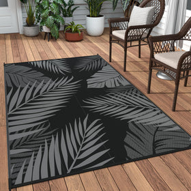GENIMO Outdoor Rug with palm leaf design on a durable waterproof surface for patios