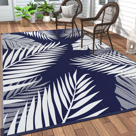 GENIMO 6x9 outdoor rug with double-sided navy palm pattern for patios.