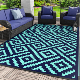 GENIMO outdoor rug 6x9 navy blue on patio—durable, weather-ready for outdoor living.