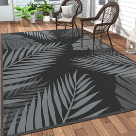 GENIMO outdoor rug with palm leaf pattern enhances patio decor