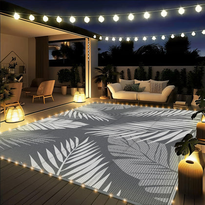 GENIMO Outdoor Rug with palm-leaf pattern enhances patio style and comfort.