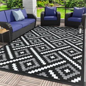 GENIMO outdoor rug 6x9 patio setup, durable for decks and balconies.
