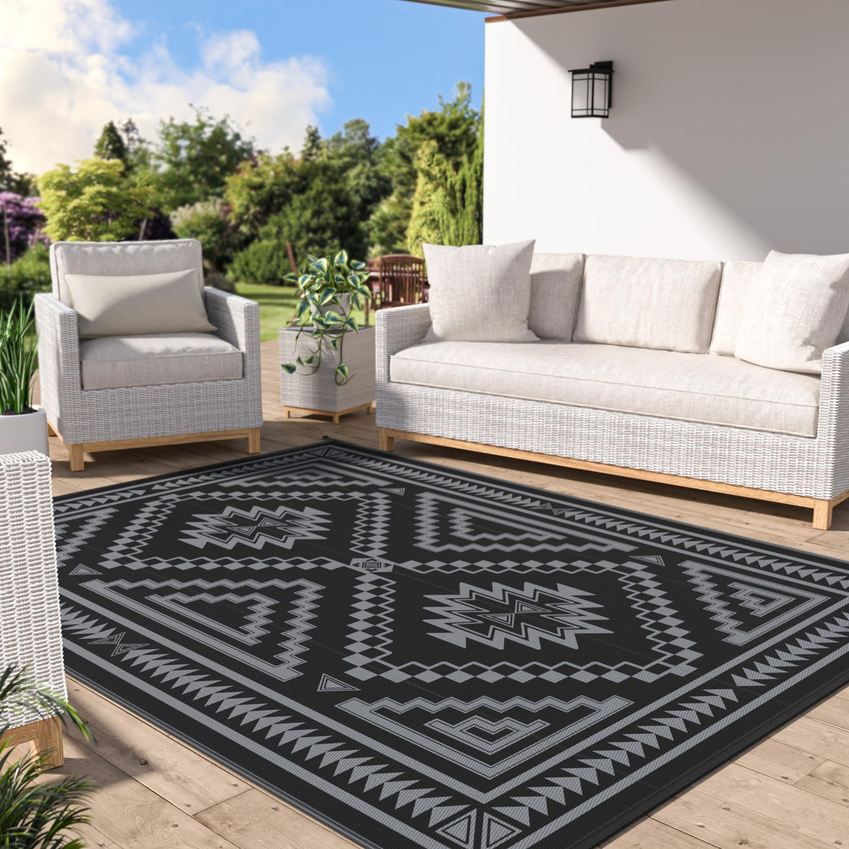 GENIMO outdoor rug 6x9 ft on patio, waterproof and easy to clean.
