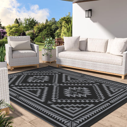 GENIMO outdoor rug 6x9 ft on patio, waterproof and easy to clean.