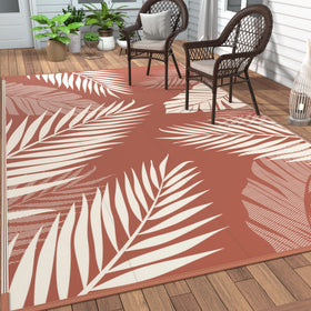 GENIMO outdoor rug palm leaf pattern in brick red, ideal for patio decor.