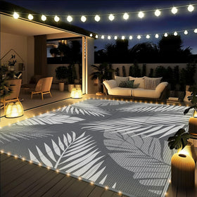 GENIMO 8x10 outdoor rug on patio, waterproof and easy to clean.