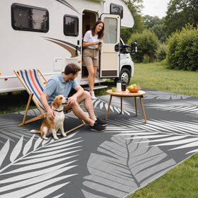 GENIMO outdoor rug shows palm leaf double-sided design for versatile outdoor styling.
