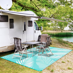 GENIMO outdoor rug features corner loops and stakes to secure on windy days
