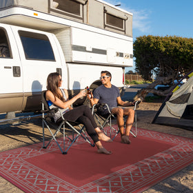 GENIMO rug features a diamond frame with a central space for furniture.