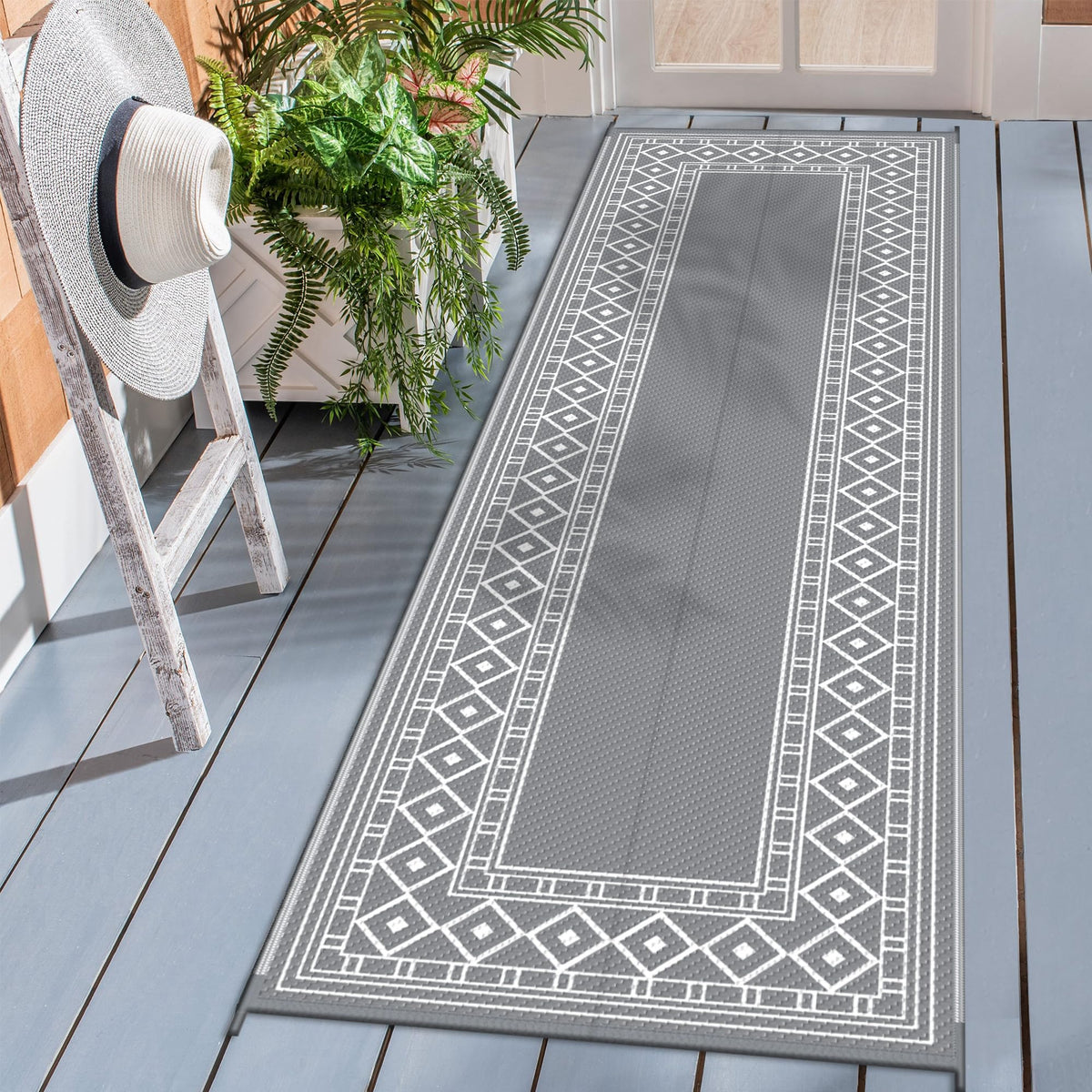 GENIMO outdoor rug with diamond-frame design enhances patio style