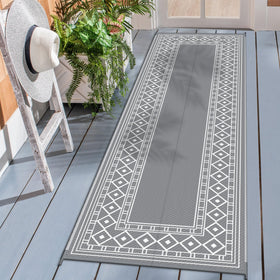 GENIMO outdoor rug with diamond-frame design enhances patio style