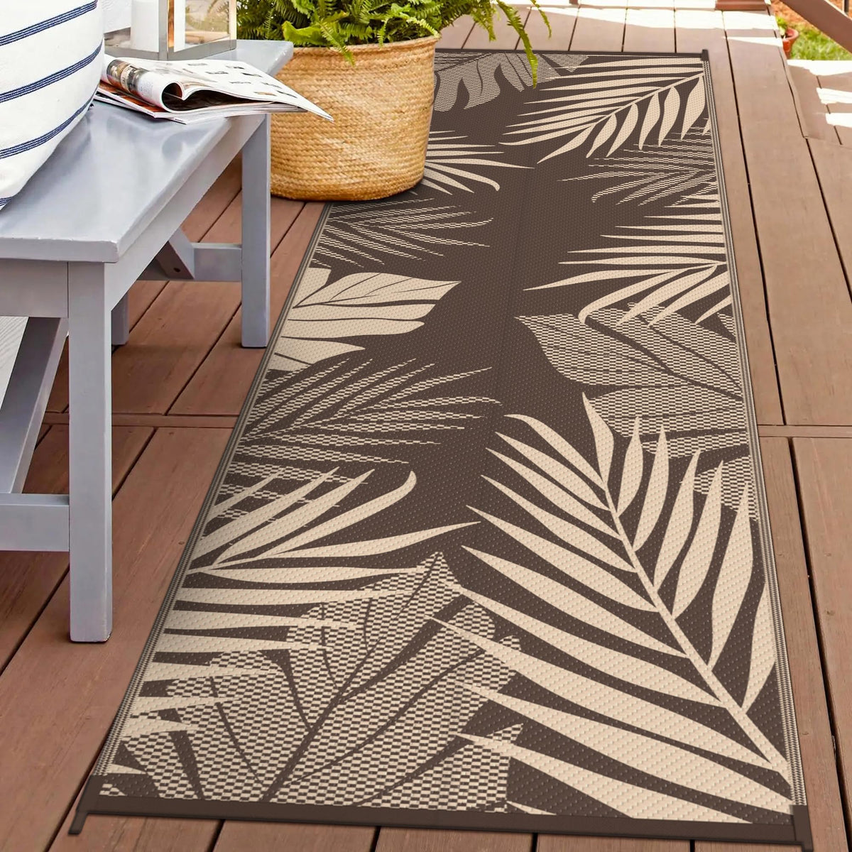 GENIMO outdoor rug: double-sided palm leaf pattern for versatile patio styling.