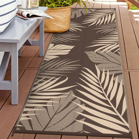 GENIMO outdoor rug: double-sided palm leaf pattern for versatile patio styling.