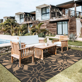 GENIMO outdoor rug with flower design enhances patio aesthetics and seating areas.