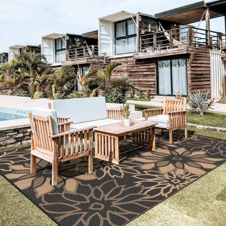 GENIMO outdoor rug with flower design enhances patio aesthetics and seating areas.