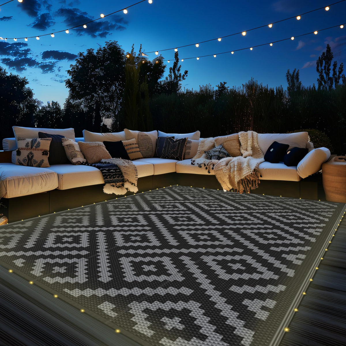 GENIMO outdoor rug with LED strip lights for ambient evening patio use.