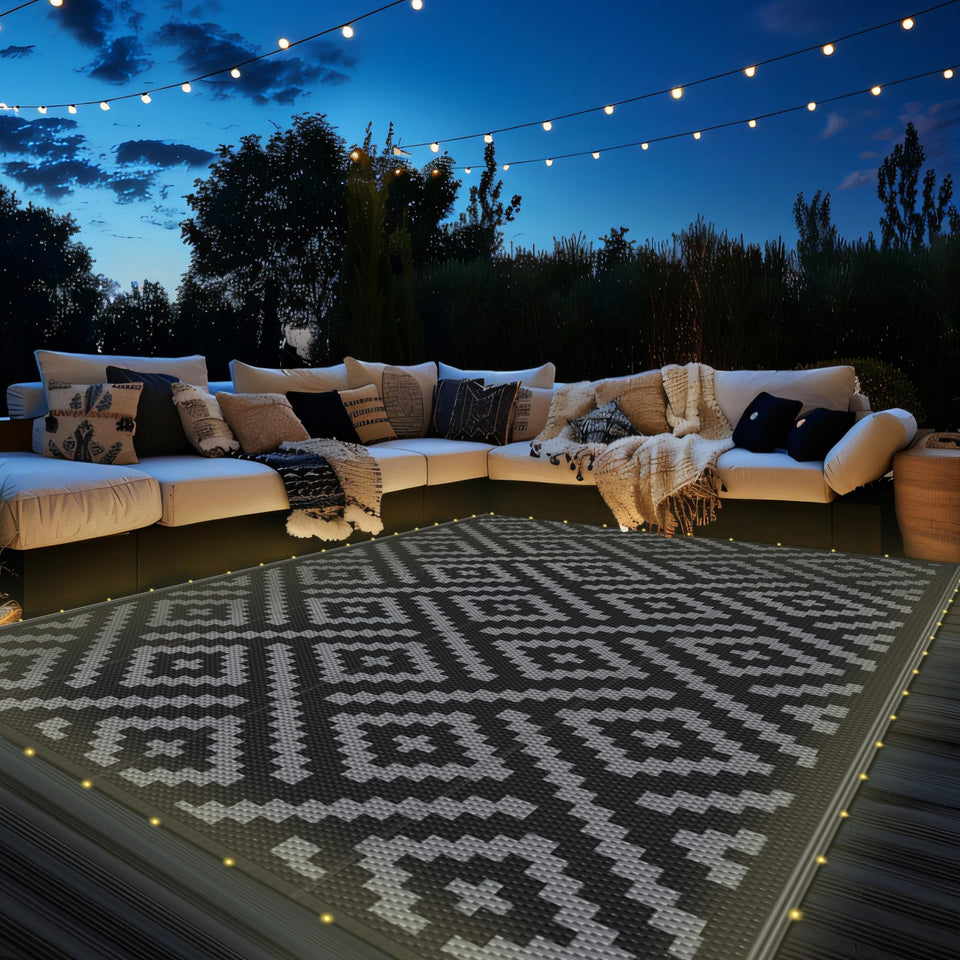 GENIMO outdoor rug with LED strip lights for ambient evening patio use.