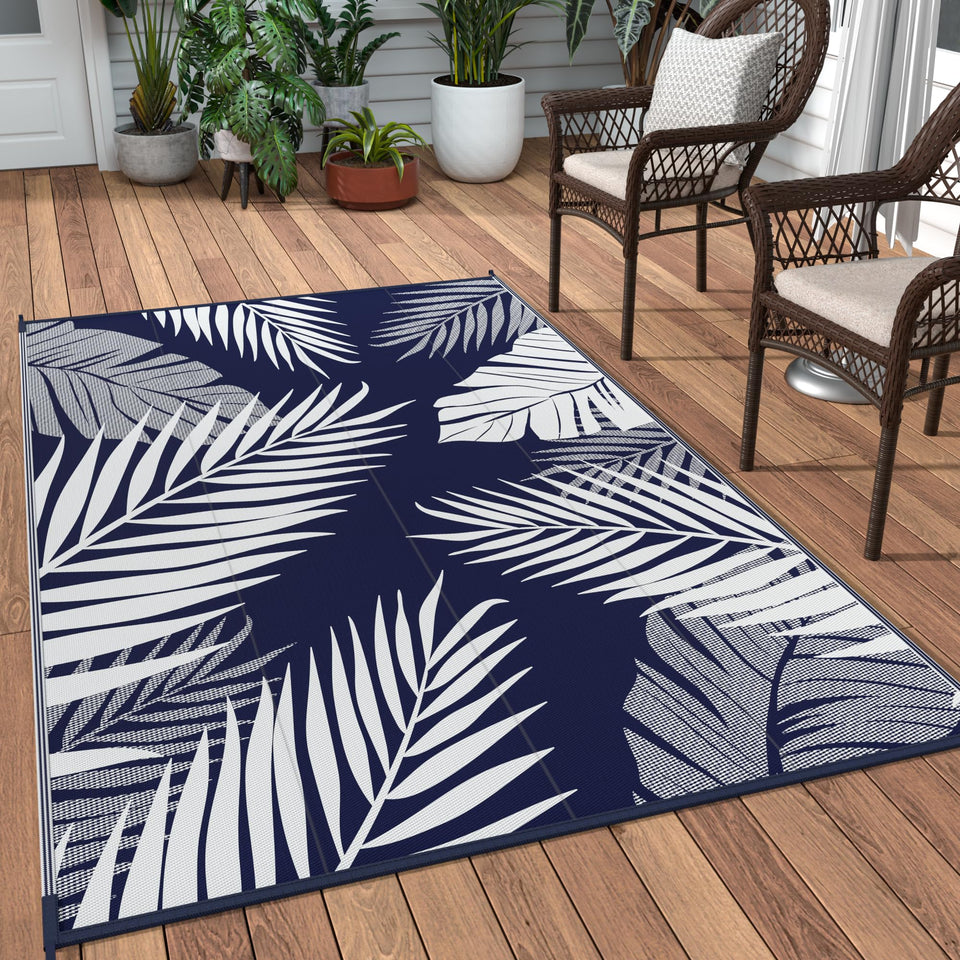 GENIMO outdoor rug with palm leaf double-sided design for versatile outdoor styling.