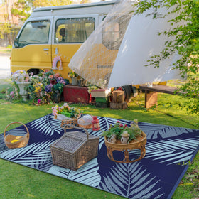 GENIMO palm-leaf design rug, double-sided for two outdoor looks.