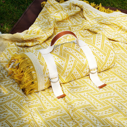 Genovega 2-in-1 extra-large rug picnic blanket folded open for beach or park use.
