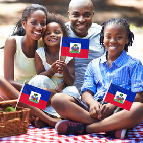 Geodurn Haiti flags in a parade scene highlighting crowd-friendly cheer props