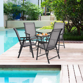 Giantex folding patio chairs opened on a sunny patio for casual dining.