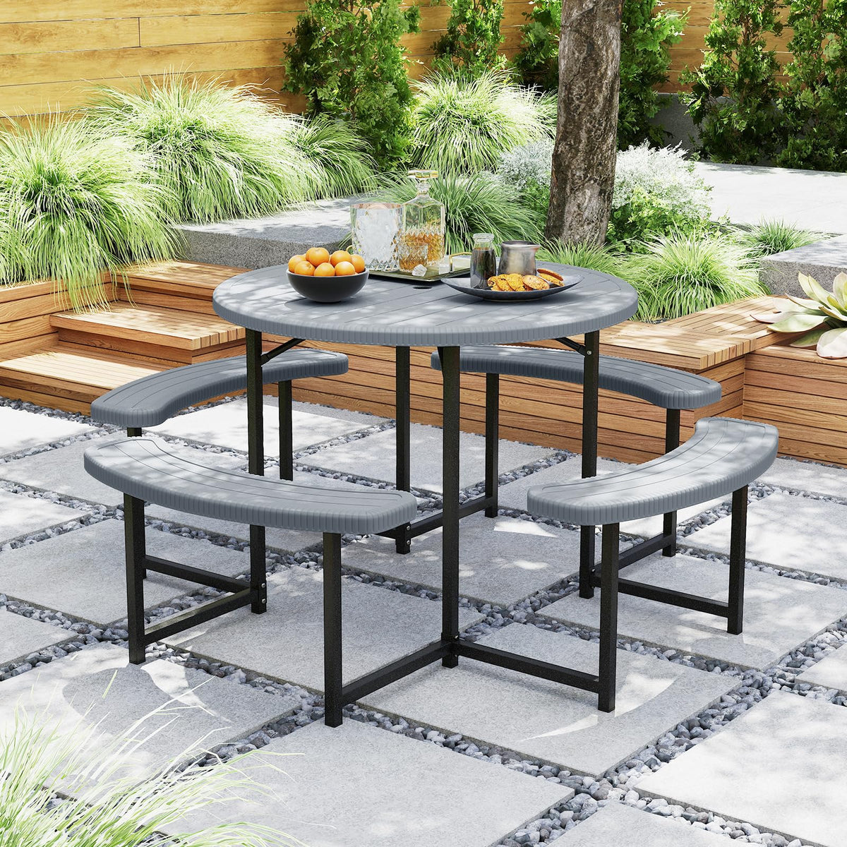 Giantex round table with umbrella hole for shaded meals outdoors.