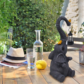 Gift Boutique whimsical elephant garden ornament creates visual interest