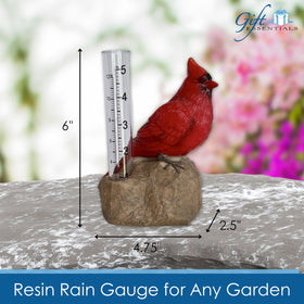 Gift Essentials Cardinal Rain Gauge in a garden setting used as decorative outdoor decor