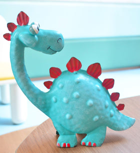 GiftMe 5 cartoon style dinosaur decor with vibrant red accents