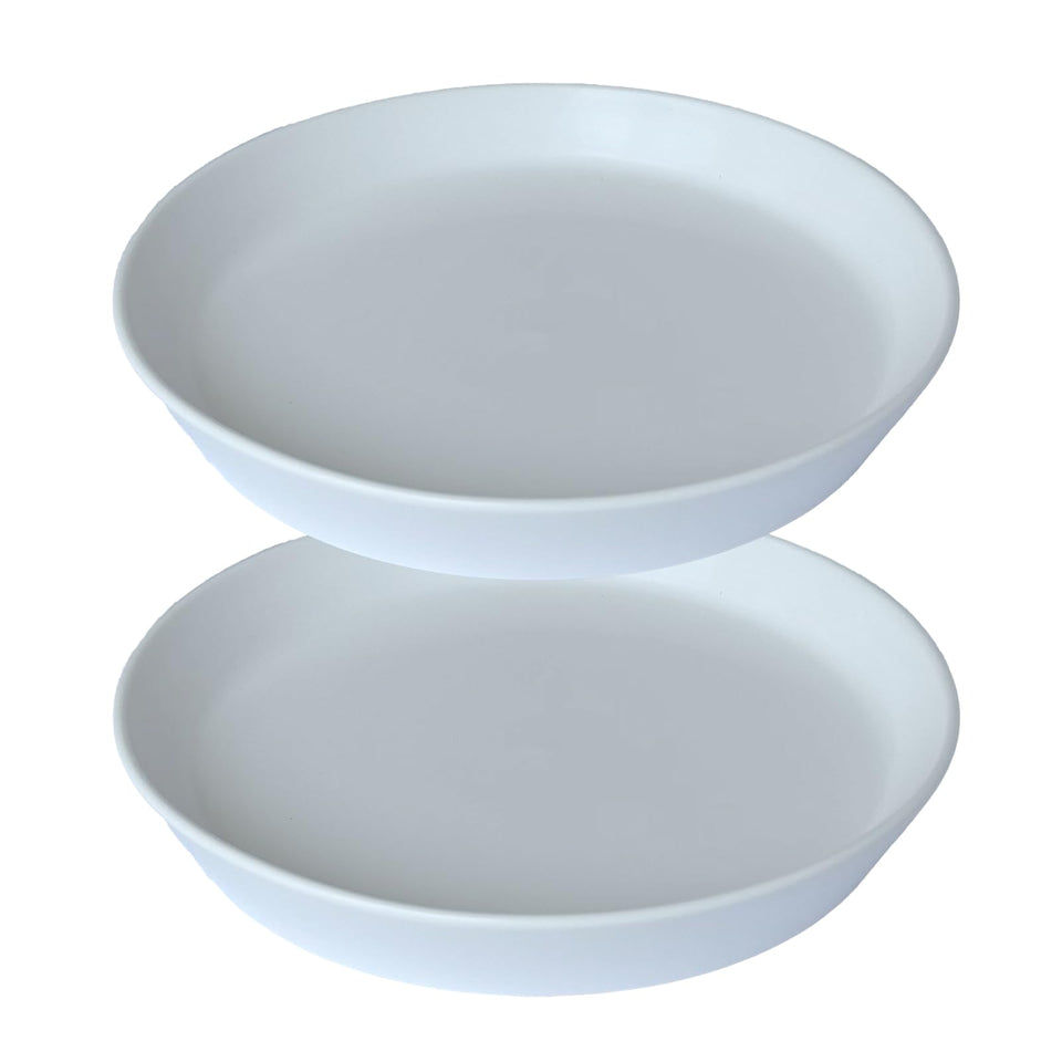 GIKUPOM 6-inch ceramic plant saucer protects surfaces during watering.