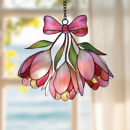 GIKZO Pink Bell Flower Acrylic Suncatcher catching sunlight with rainbow hues.