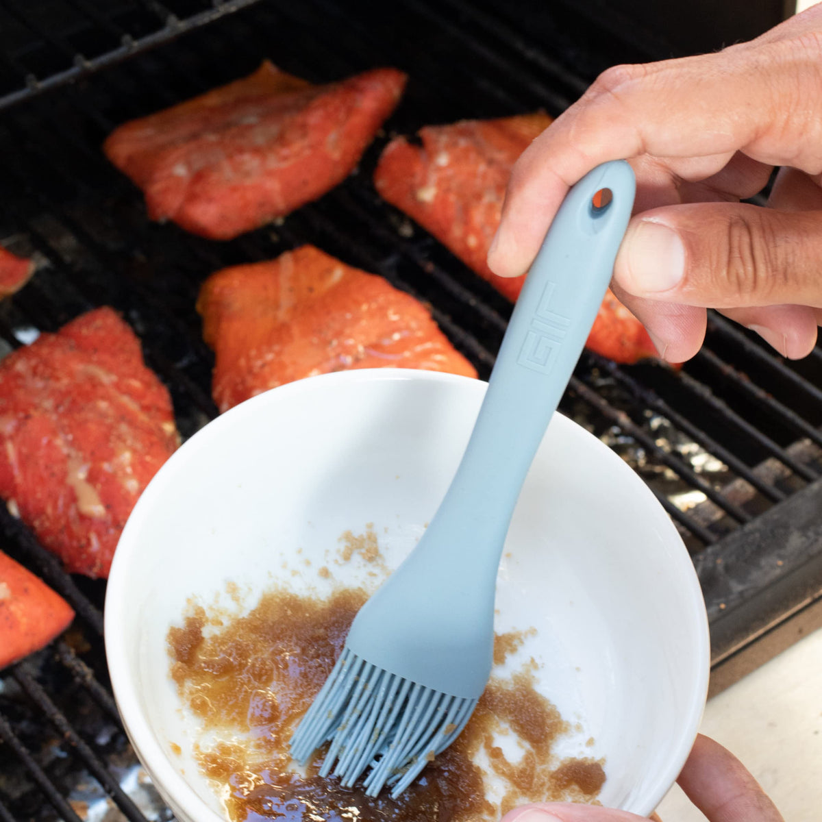 GIR Get It Right dishwasher-safe silicone brush for quick cleanup after cooking.