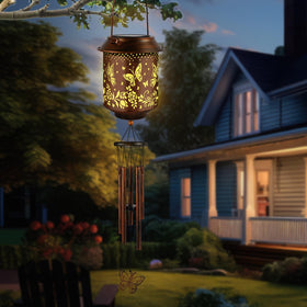 GLDFI butterfly motif lantern enhances evening garden ambience