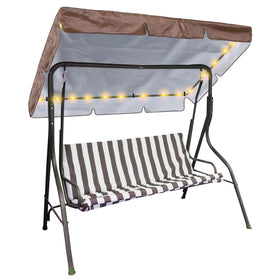GliCraft LED lighted porch swing canopy installed on a patio for evening ambiance.