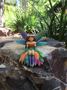 GlitZGlam Daisy hand painted fairy with vivid turquoise and gold details.