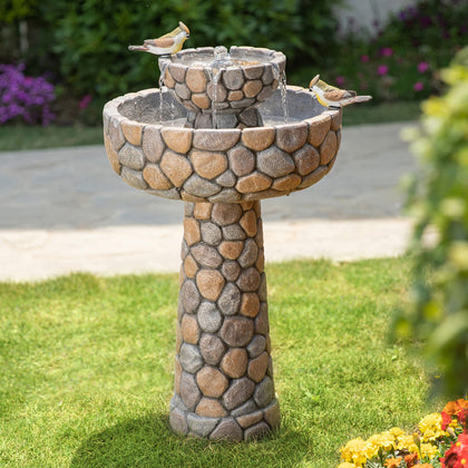 Glitzhome 2-Tier Stone-Like Fountain with Birds, attracting songbirds and creating a tranquil garden focal point.