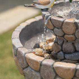Glitzhome Patio Centerpiece Fountain enhances garden ambience for relaxing moments.