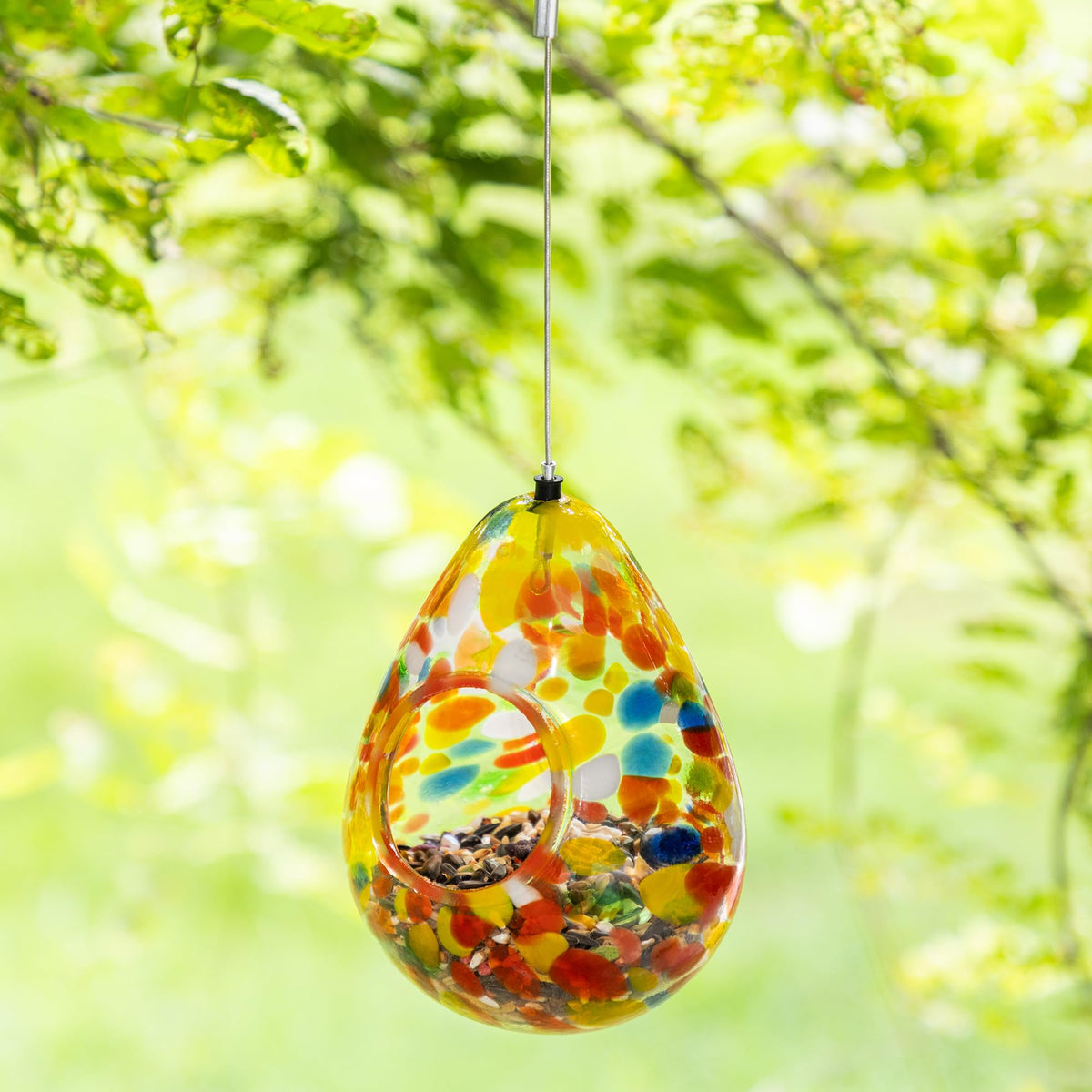 Glitzhome water drop birdfeeder outdoors, colorful garden birds.