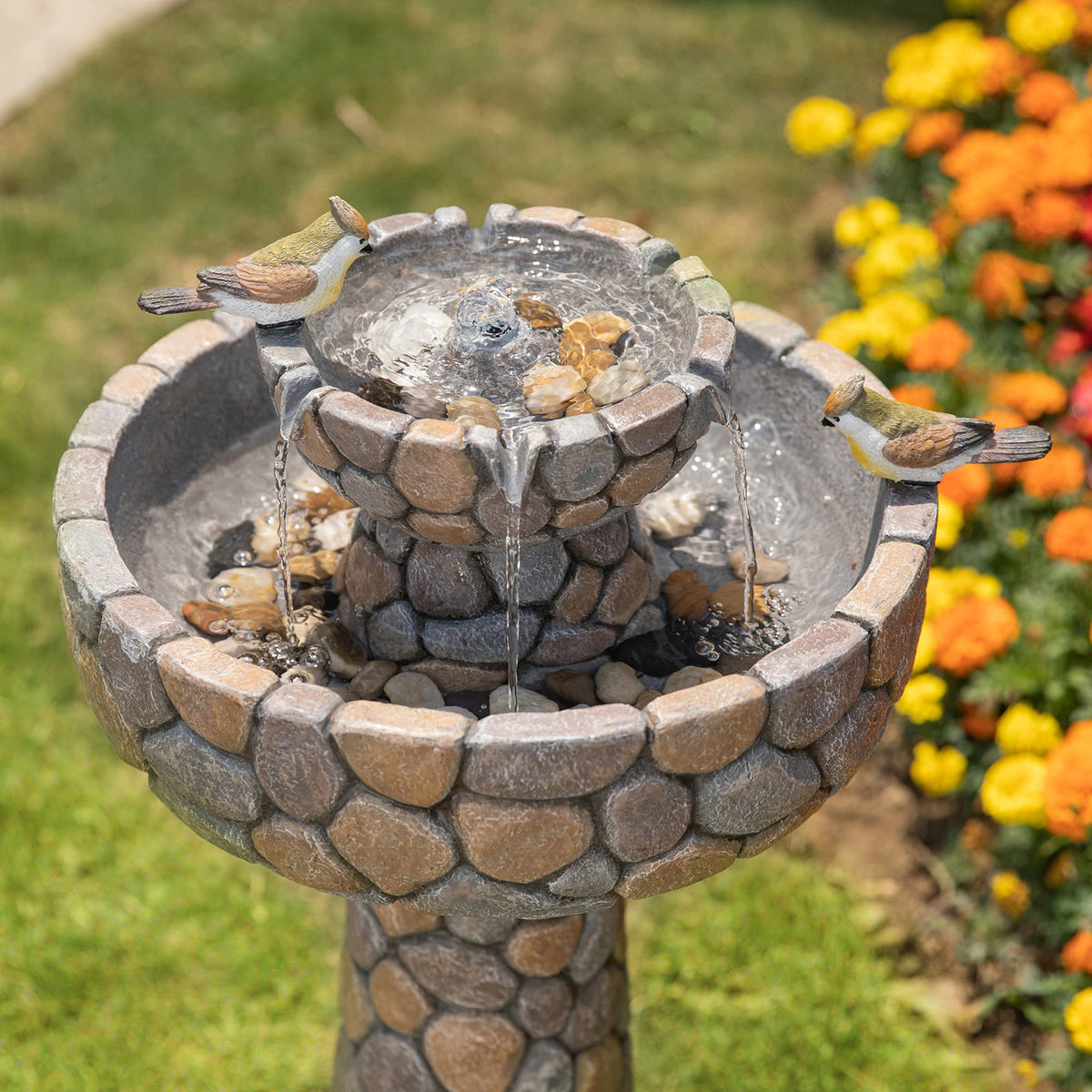 Glitzhome Water Flow Cascade creates a soothing fountain effect for backyards.