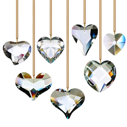 GOLDENHAITAI heart crystal suncatchers in a 7-piece set catching sunlight to create rainbows in windows.