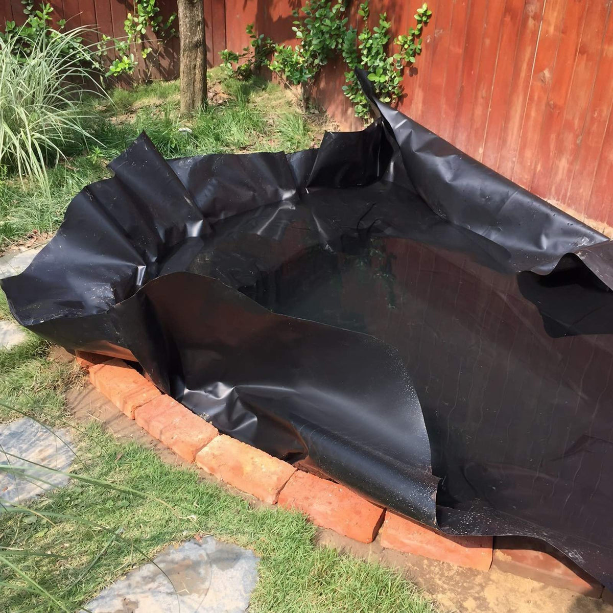 Goldshire liner adapts to sweeping corners for pond installation.