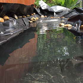 Goldshire pond liner installed in a water garden for a natural look.