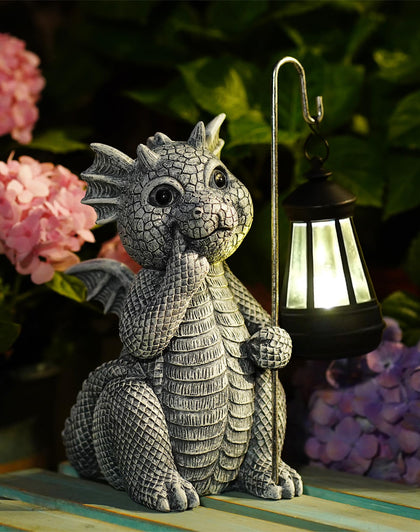 Goodeco dragon garden statue with solar lantern illuminating outdoor spaces at night