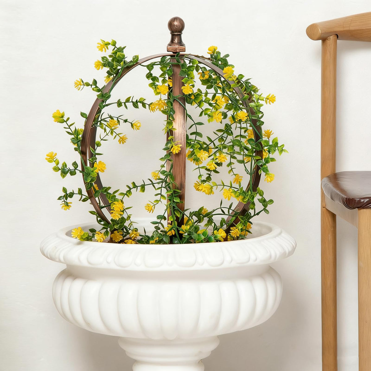 Goooxim lightweight outdoor trellis obelisk moves easily.