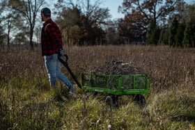 Gorilla Carts 2-in-1 handle enables easy manual use or towing behind equipment.