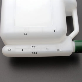 Grebizan 1L bottle clear marks help users verify correct fuel-oil proportions.