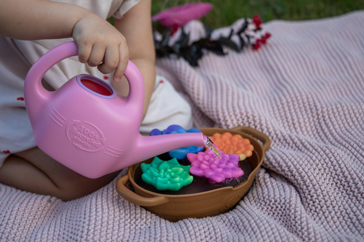Green Toys Rainbow Bloom set color-change succulents for interactive learning.