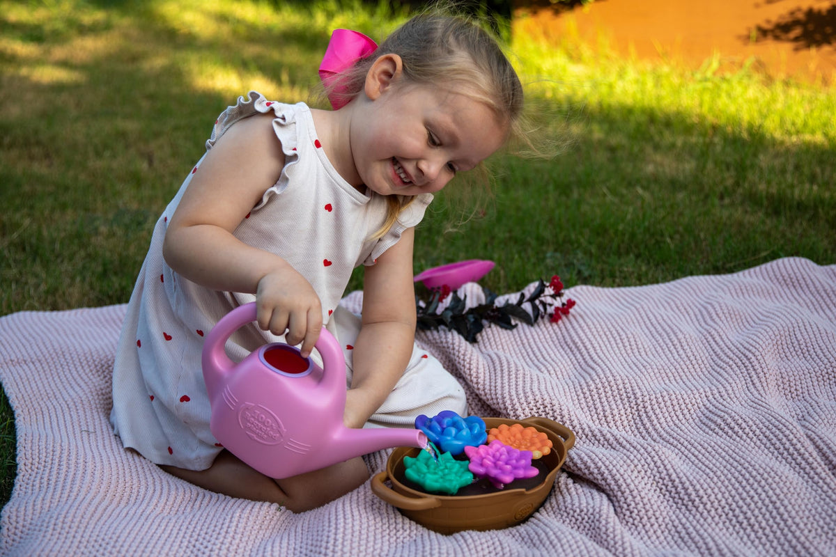 Green Toys Rainbow Bloom set display for outdoor garden play.